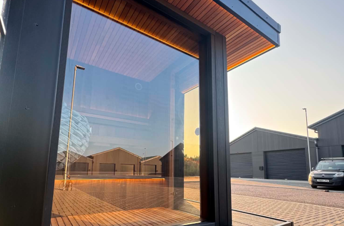 Black garden room with glazed corner window at the Lytham Exterior Spaces showroom