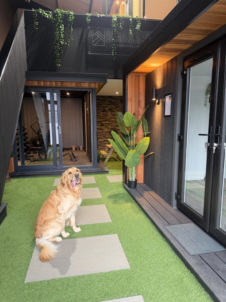 Showroom garden room display with Bonnie the dog